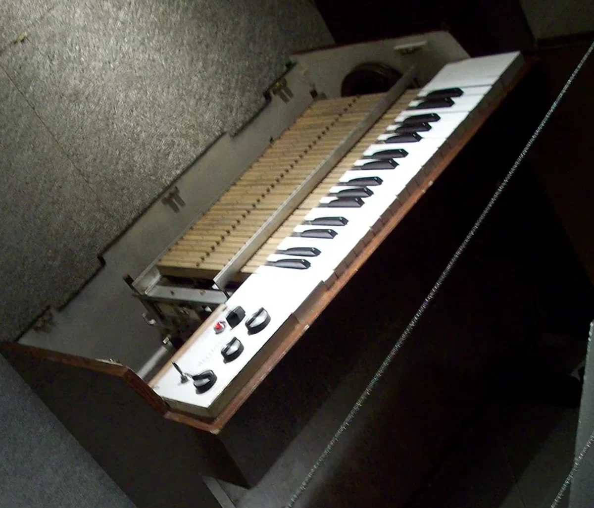 Detail crop of the open Mellotron M400 showing its keys and removable tape frame