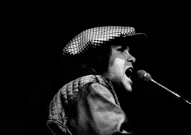Elton John in a period performance photograph
