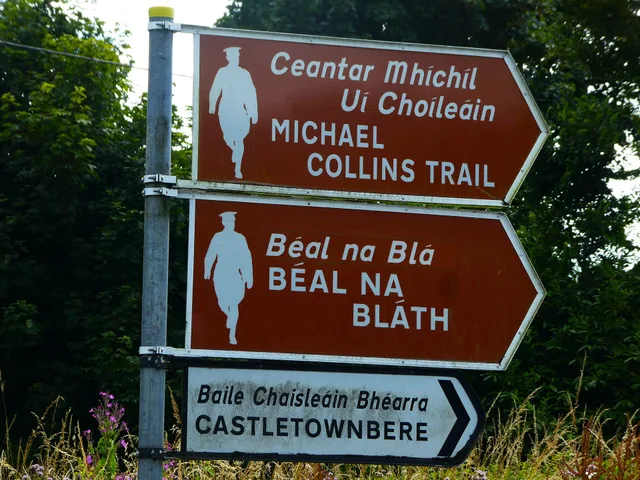 Bilingual Irish English directional fingerposts, commemorating the ambush of Michael Collins at Béal na Bláth during the Irish Civil War, in 1922.