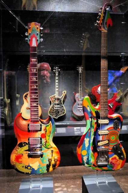 Psychedelically painted instruments associated with Eric Clapton and Jack Bruce