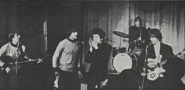 Bob Dylan playing electric guitar with The Byrds in 1965