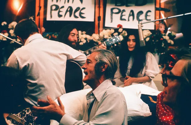 John Lennon performing Give Peace a Chance in 1969