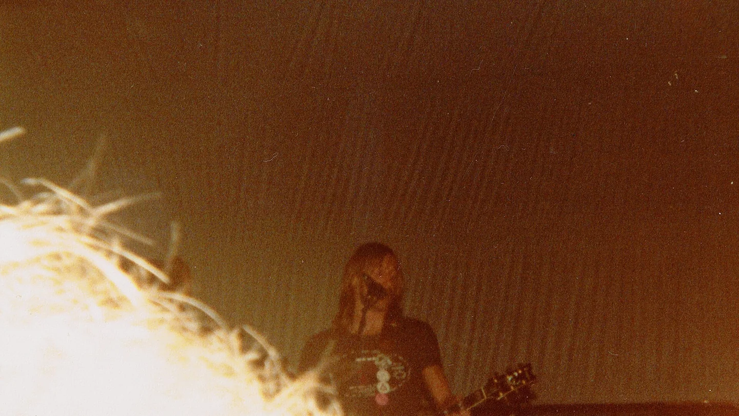 Hawkwind performing under red and blue stage lights in St Albans in 1979